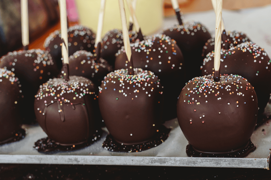 Chocolate-dipped apples with sprinkles.